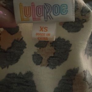 LuLaRoe Irma tunic in cheetah printNice and easy with leggings or skinny jeans.